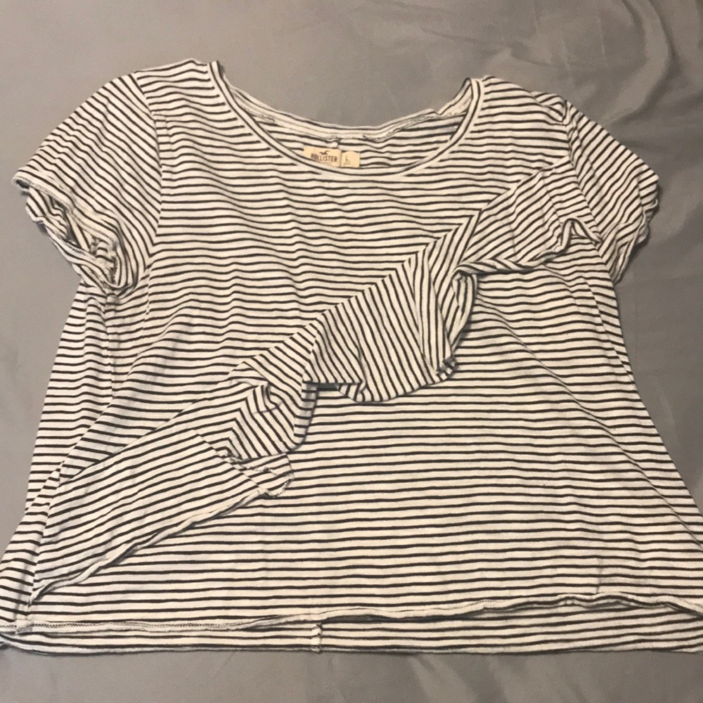 Hollister Shirt w/ Ruffle Running Down Diagonally.